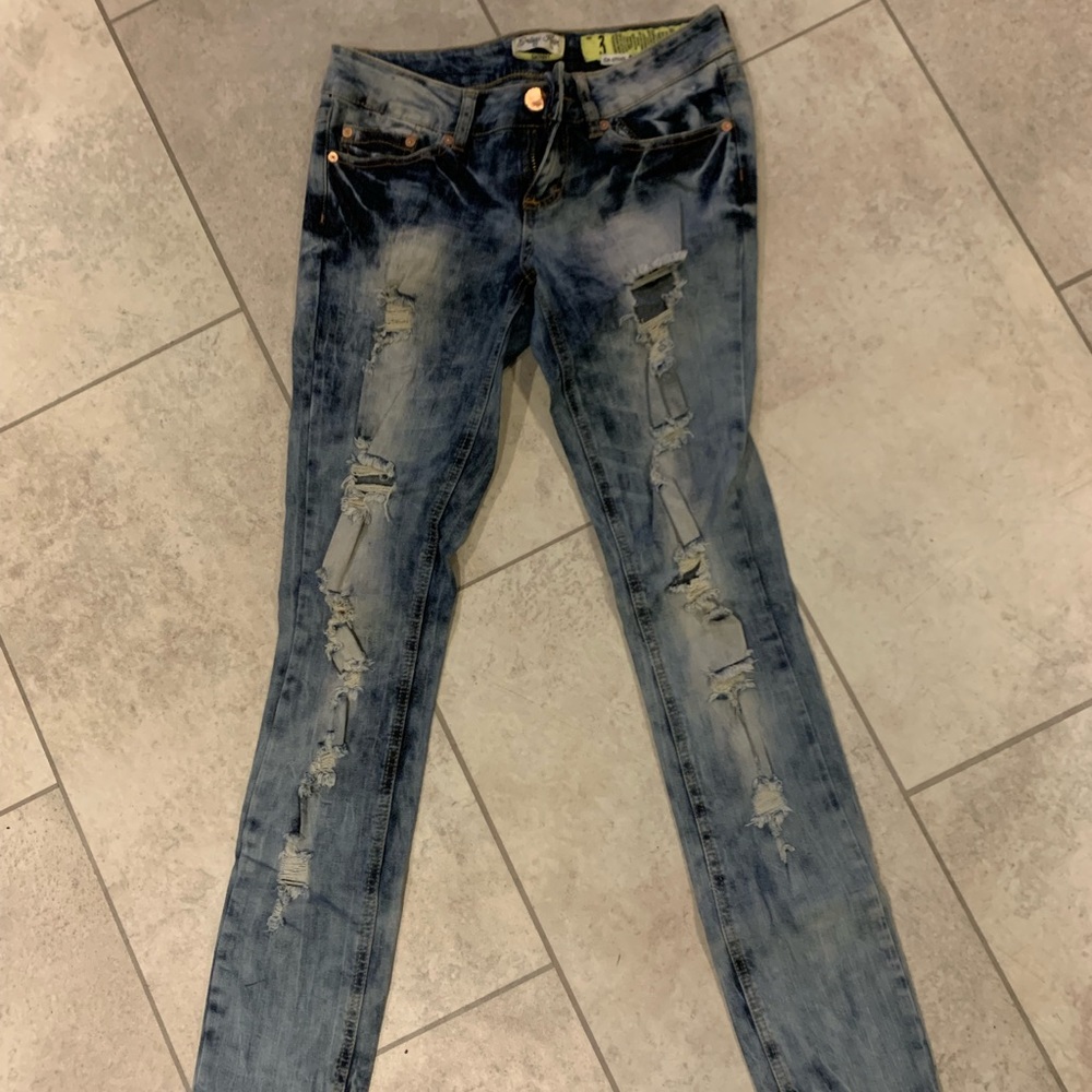 Distressed skinny acid wash jeans